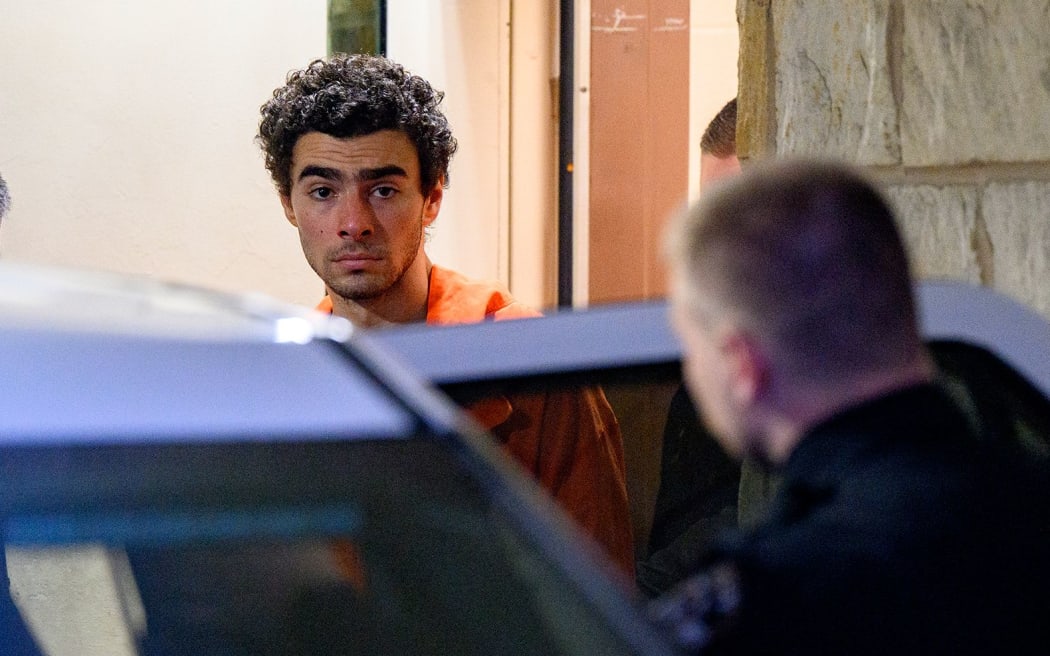 Suspected shooter Luigi Mangione is led from the Blair County Courthouse after an extradition hearing Tuesday in Hollidaysburg, Pennsylvania.