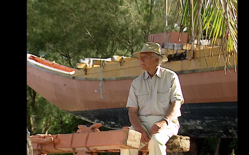 Papa Tom sits in front of a vaka