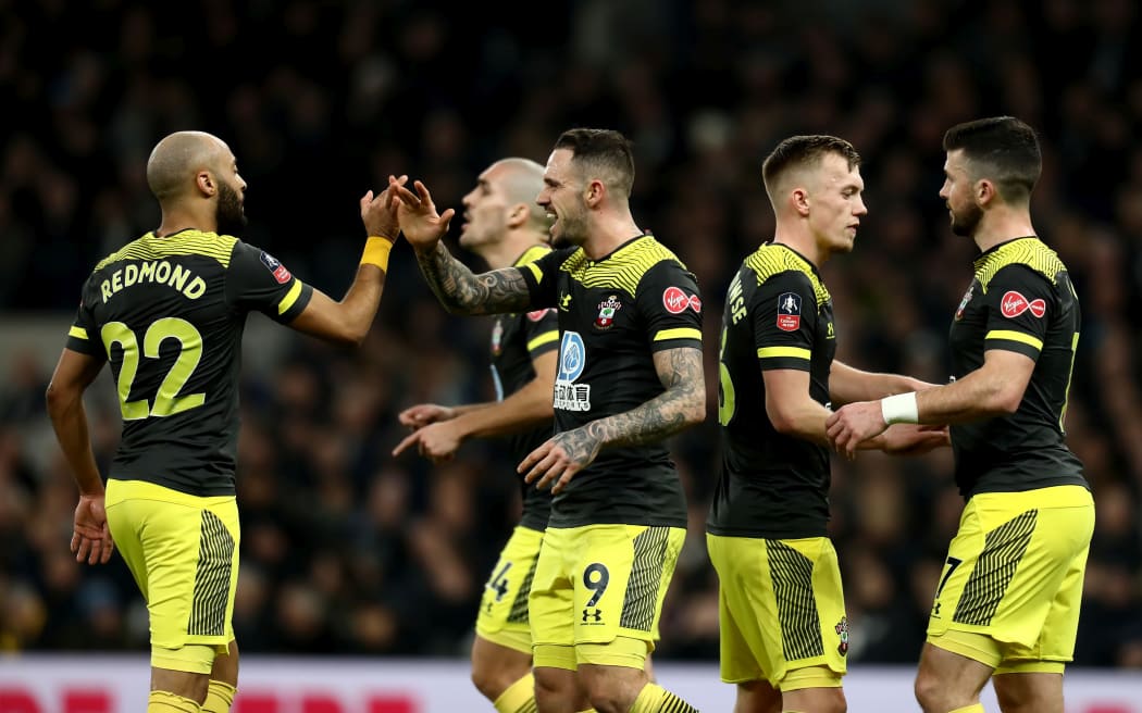 Shane Long of Southampton celebrates his goal with team mates during a match against Tottenham Hotspur in the English Premier League.