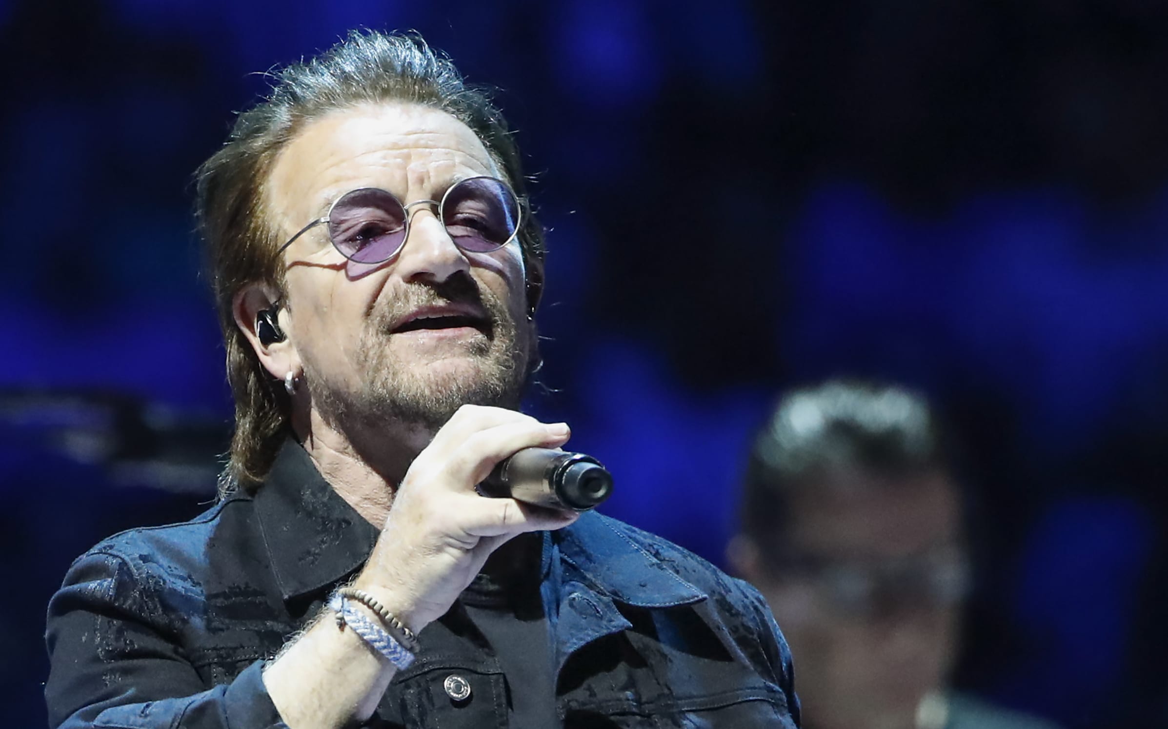 Bono of the Irish rock band U2 performs during the "Experience + Innocence" tour at the United Center in Chicago on May 23, 2018. / AFP PHOTO / Kamil Krzaczynski