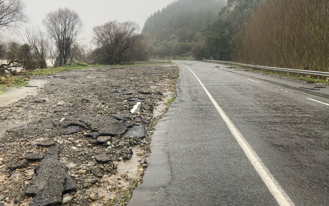 Flood damage evident on State Highway 6 after severe flooding.