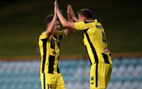 Sam Sutton (left) and Scott Wootton celebrate a win over Perth Glory in 2022.