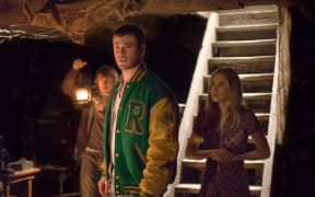 Fran Kranz, Chris Hemsworth, and Anna Hutchison, starring in The Cabin in the Woods (2011).