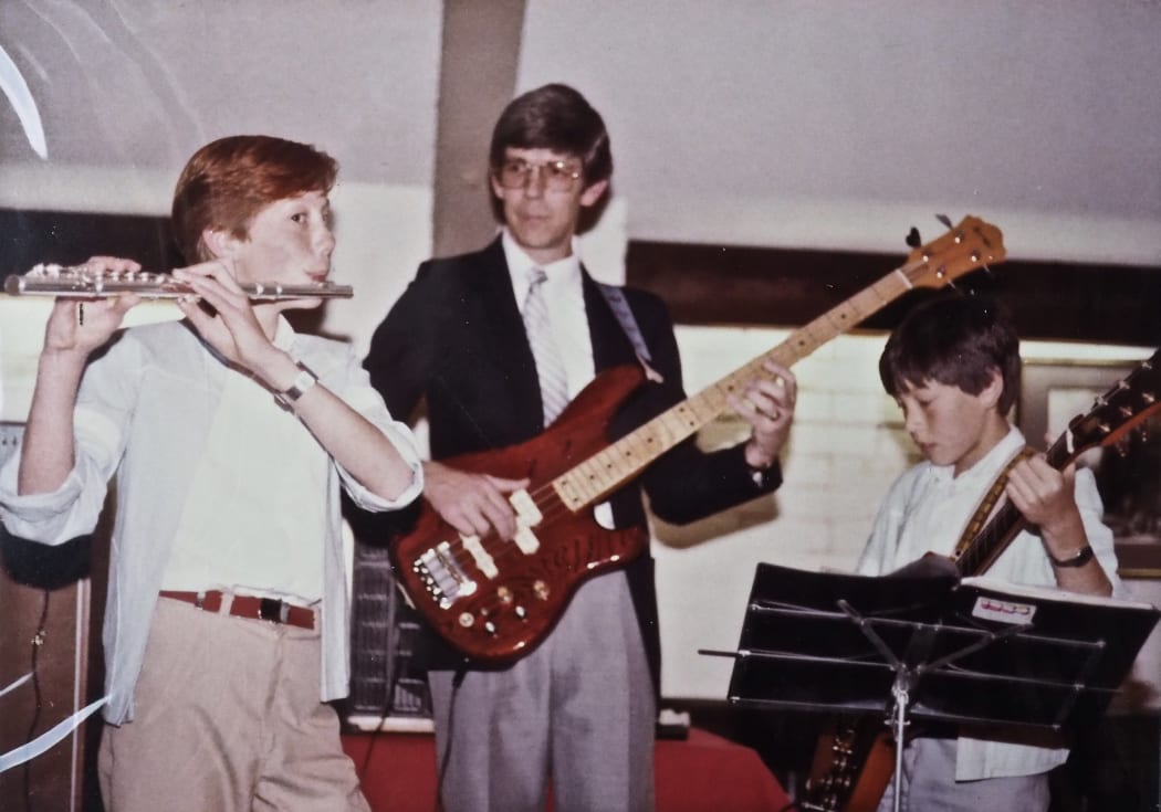 Nathan Haines playing with his dad Kevin and younger brother Joel