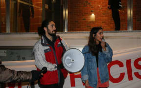 Protesters at Nigel Farage even, including Green MP Golriz Ghahraman (R).