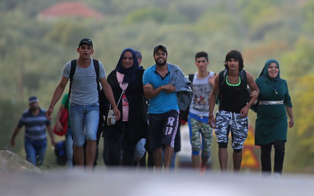 Refugees make their way to a registration centre in Lesbos Island, Greece, 7 September 2015.