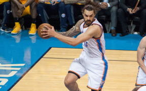 Steven Adams brings down a rebound for the Thunder.