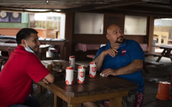 Patrons at the West Alabama Ice House have beers before Texas Governor Greg Abbotts order that all bars are to be closed at noon today in Houston, Texas on June 26, 2020.