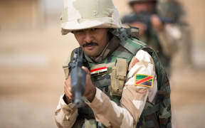 Iraqi troops training in urban clearances and tactics.