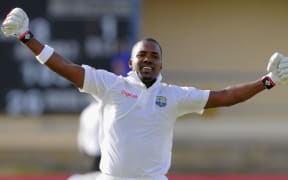 The West Indies batsman Darren Bravo celebrates.