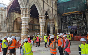 Community leaders and project staff gather inside the Christ Church Cathedral on Tuesday.