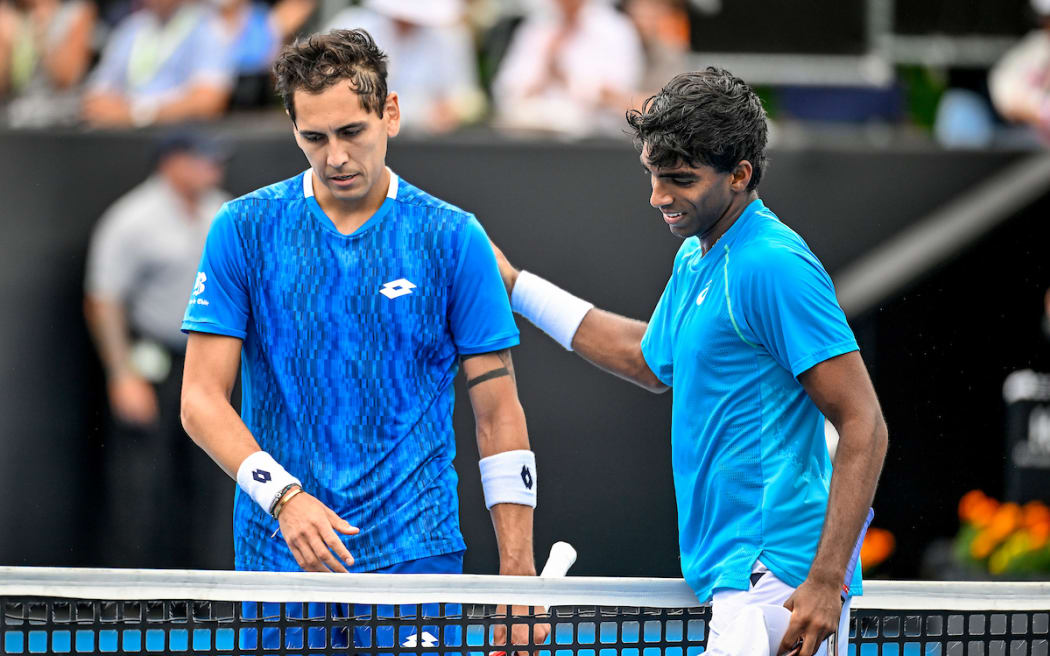 Match winner Nishesh Basavareddy of USA consoles Alejandro Tabilo of Chile after the game in the Round 2, R16 Men’s Singles Match of the 2025 Men’s ASB Classic tennis tournament.