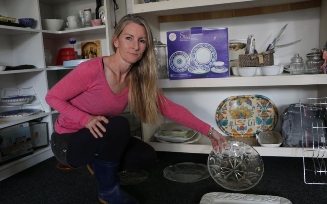 Lisa Ashfield is counting the cost of the 20 centimetres of floodwater which went through her Little River second-hand store.