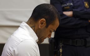 Brazilian footballer Dani Alves looks down during his trial at the High Court of Justice of Catalonia in Barcelona, 2024.
