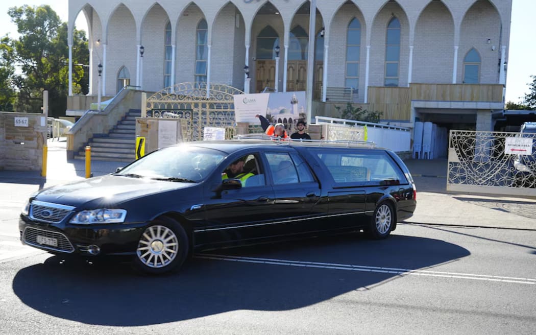 Lorenzo Lemalu's hearse leaving Lakemba mosque on Sunday. (ABC News: Anton Rose)