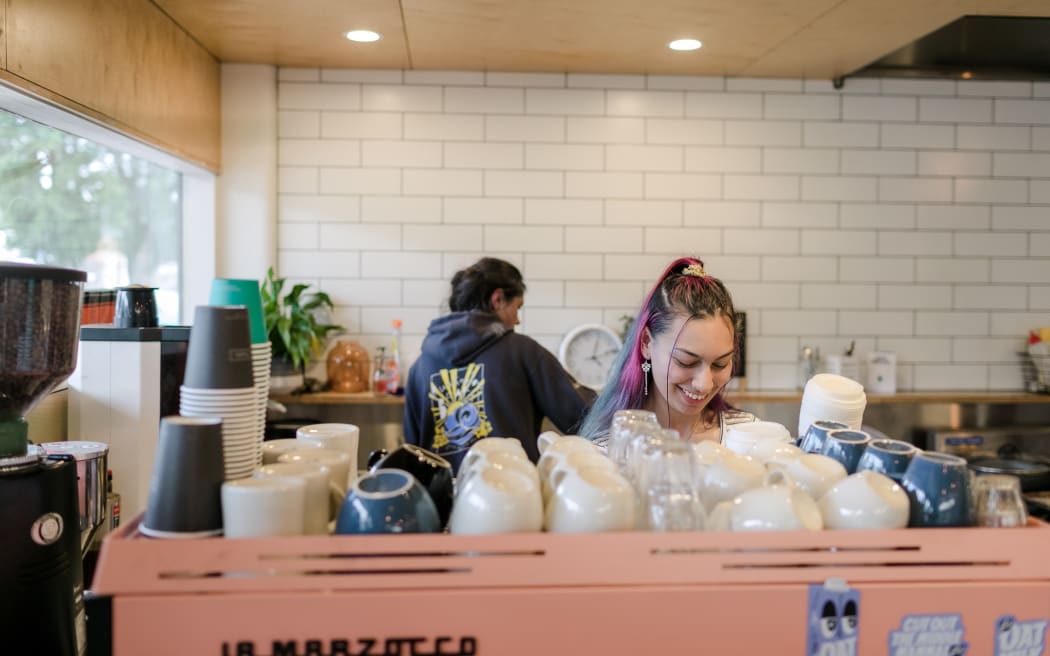 Two participants of Youth Inspire's 'Licence to Work' programme working at Trade School Kitchen.