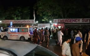 KABUL, AFGHANISTAN - AUGUST 26: Injured people being carried to a hospital as unspecified number of casualties reported after two explosions outside Hamid Karzai International Airport in Kabul, Afghanistan on August 26, 2021.