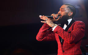 Nipsey Hussle performs onstage at the Warner Music Pre-Grammy Party in February.