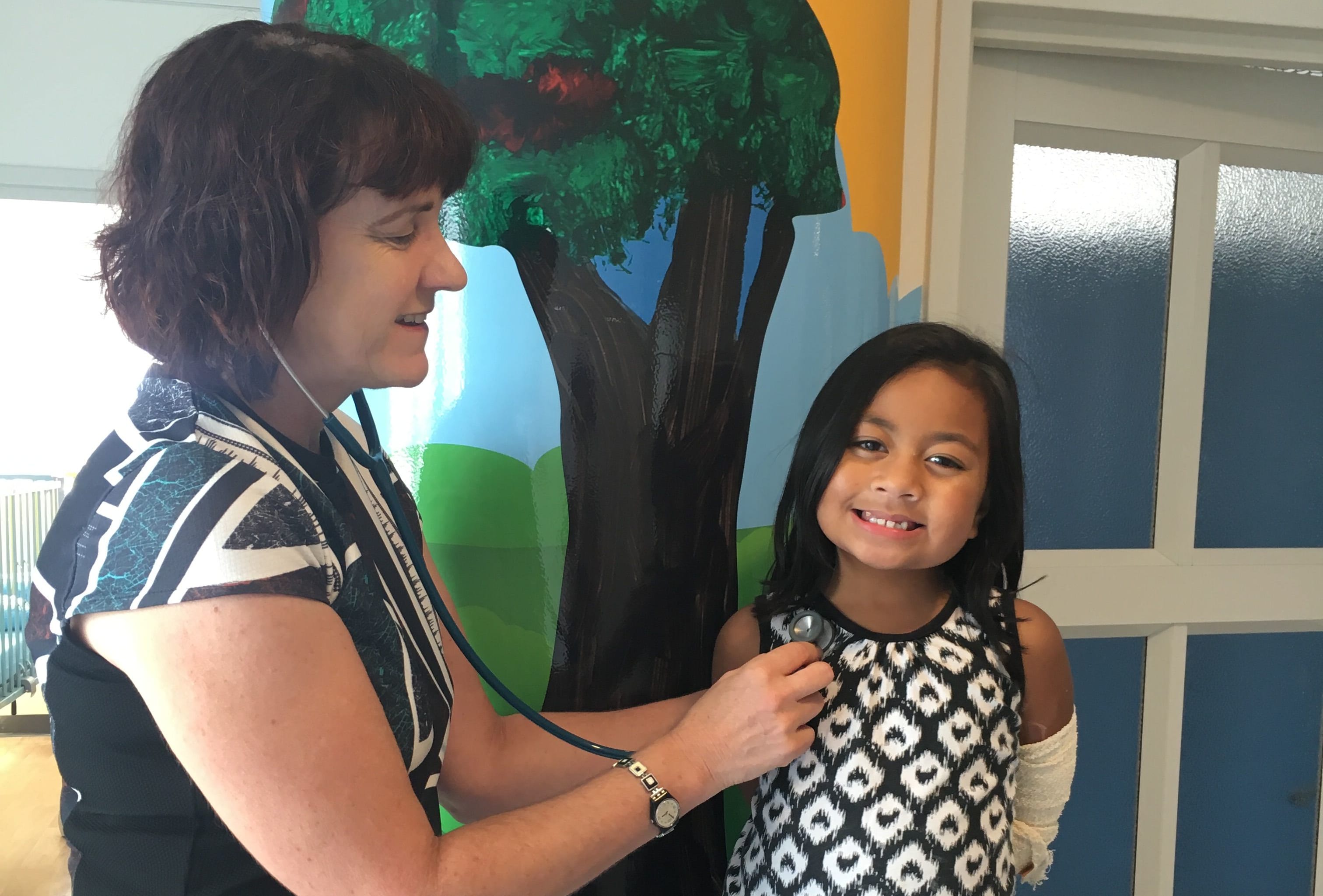 Mafi Manu, 7, in Auckland's Starship Children's Hospital for treatment with paediatrician Catherine Byrnes.