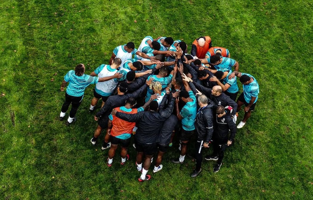 The Flying Fijians come together in training.