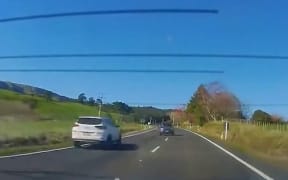 Footage caught by a motorist and released by police, shows a car drifting over lines on both sides of the lane on SH29, narrowly avoiding multiple collisions with cars and large trucks.