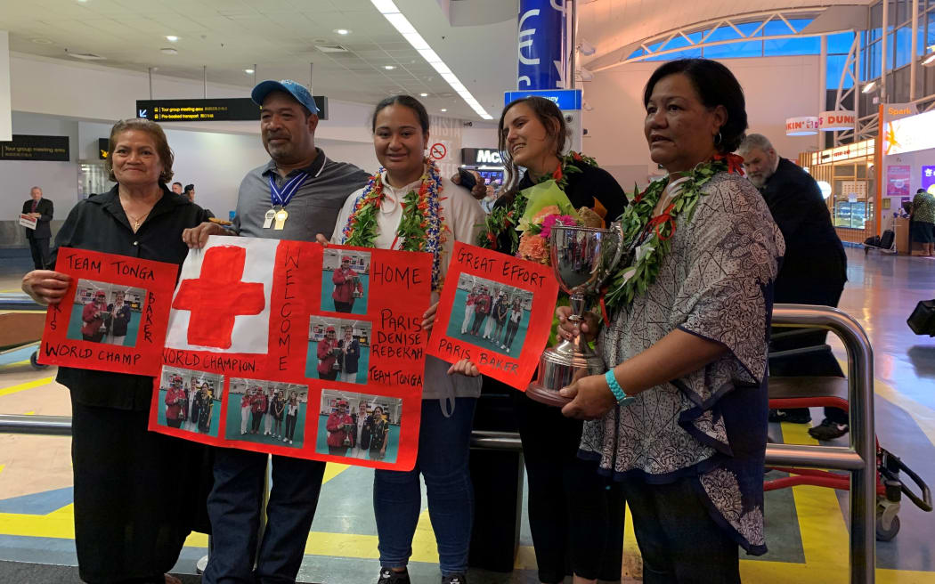 Paris Baker's family welcome home their world champion at Auckland Airport.