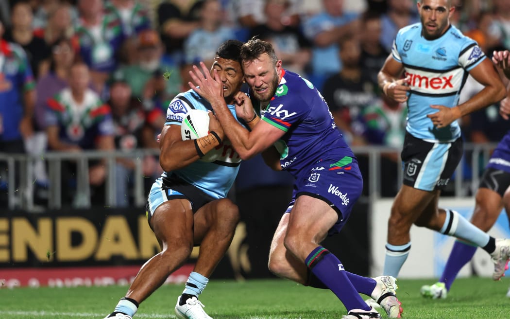 Kurt Capewell tackles Sharks winger Ronaldo Mulitalo,