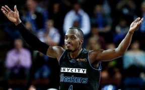Cedric Jackson of the Breakers celebrates a three pointer.