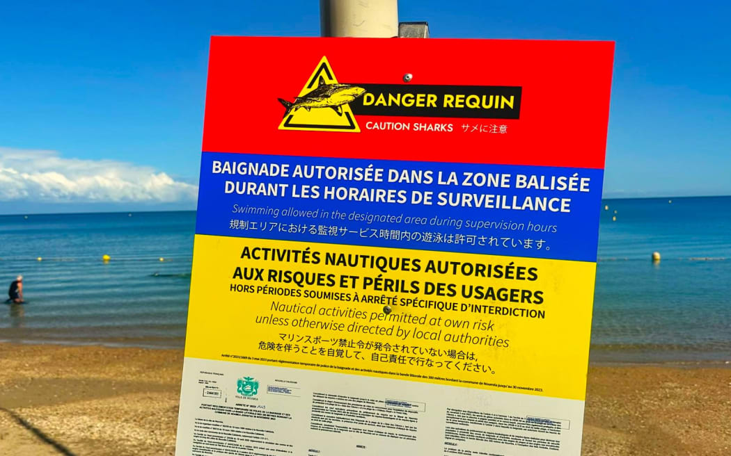 Danger shark no swimming sign on Nouméa beach in New Caledonia