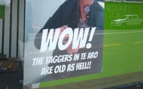Superloans display an edited photo featuring a woman who vandalised their storefront.