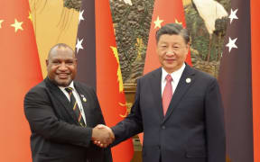 PM James Marape, left, and Chinese President Xi Jinping.