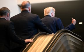 NEW YORK, NEW YORK - SEPTEMBER 23: U.S. President Donald Trump (R) gestures after walking up an escalator as he arrives to the 80th session of the UN’s General Assembly (UNGA) at the United Nations headquarters on September 23, 2025 in New York City. World leaders convened for the 80th Session of UNGA, with this year’s theme for the annual global meeting being “Better together: 80 years and more for peace, development and human rights.”