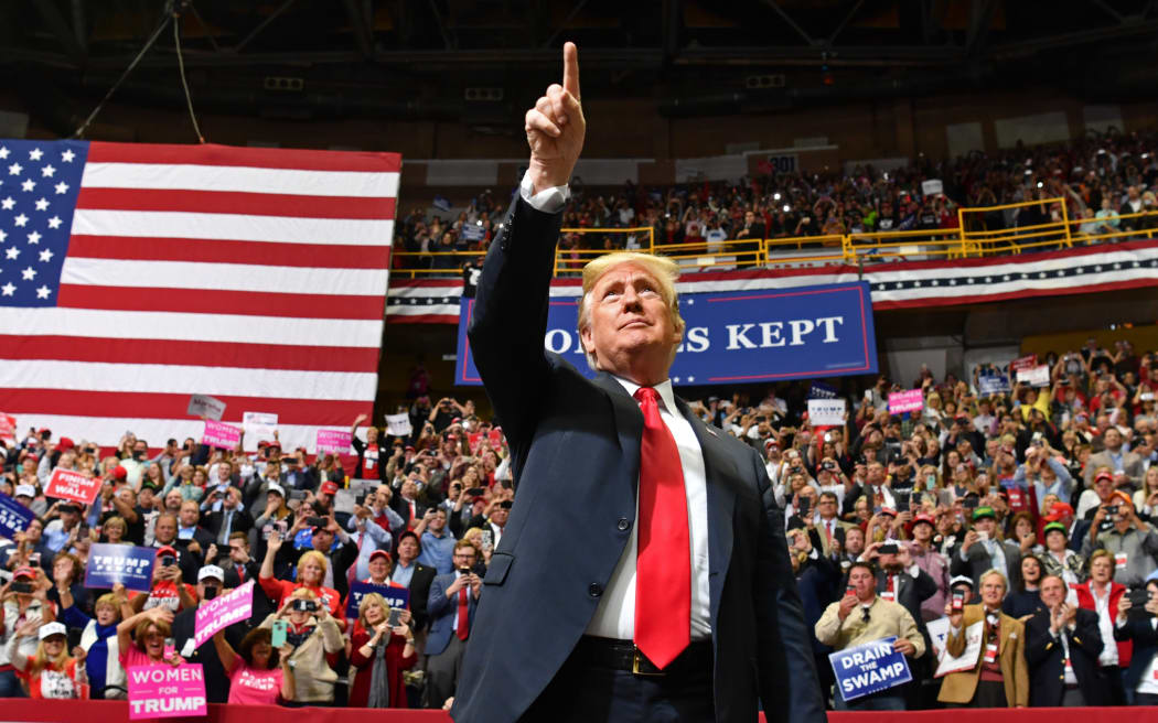 US President Donald Trump arrives for a "Make America Great Again" campaign rally at McKenzie Arena, in Chattanooga, Tennessee on November 4, 2018. (Photo by Nicholas Kamm / AFP)