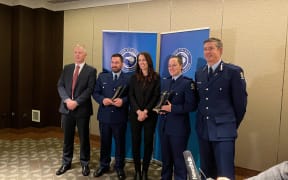 From left NZ Police Association president Chris Cahill, Detective Constable Jeremy Toschi, Prime Minister Jacinda Ardern, Constable Sophie Allison, and Police Commissioner Andrew Coster.