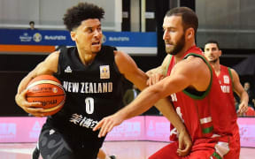 Tall Blacks Tai Webster fends off  Lebanon's Elias Ruston during the Tall Blacks win over Lebanon in Rotorua.