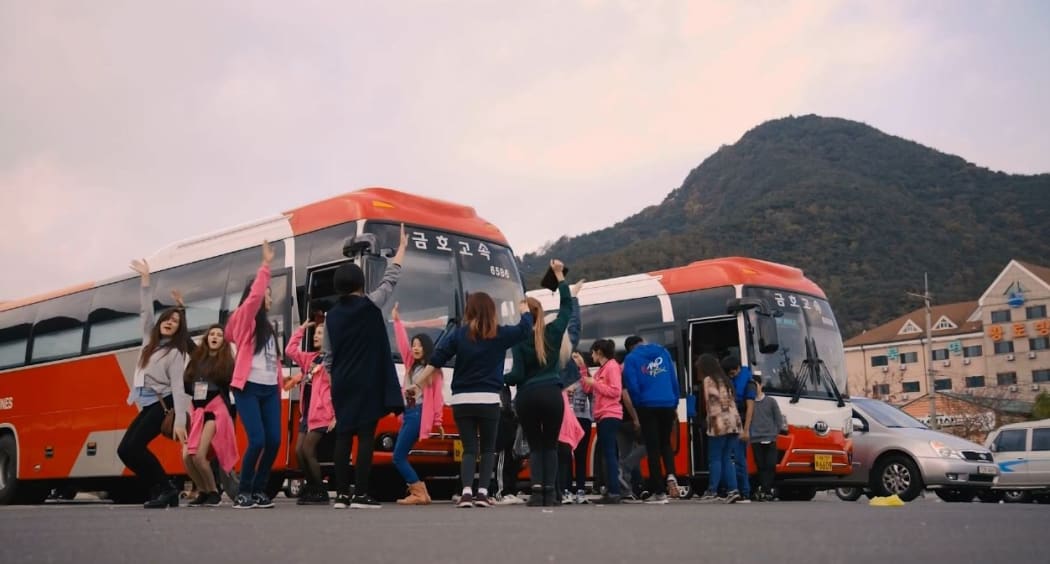 K-pop World Festival competitors practice their moves before getting on a bus