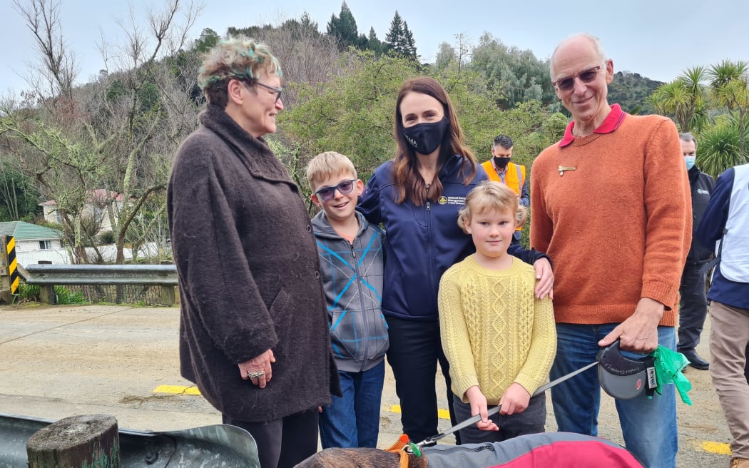 Jacinda Ardern has spent the day surveying the damage from last week's floods and hearing from residents affected by the deluge. Here she is with (from left) Christine Hafermatz-Wheeler, Robert and Amara, and David Wheeler.