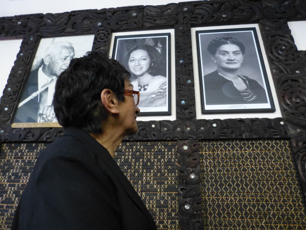 Te Haina Rātana Raumaewa looks up at the photo of her mother Iriaka Rātana, on the right.