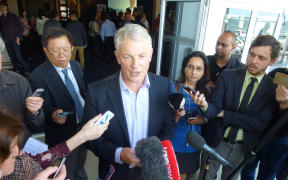 Phil Goff talking to media after confirming he would run for the Auckland mayoralty.