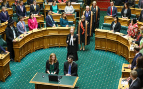 Acting Black Rod Sandra McKie leads the three Commissioners, Chief Justice Dame Helen Winkelmann, Sir William Young, and  Dame Susan Glazebrook