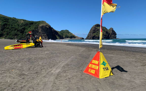 Surf lifesavers at Piha Beach