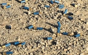 Used shotgun shells on the Okuku River bed.