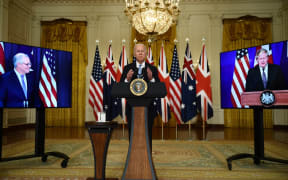 US President Joe Biden participates is a virtual press conference on national security with British Prime Minister Boris Johnson (R) and Australian Prime Minister Scott Morrison in the East Room of the White House in Washington, DC, on September 15, 2021.