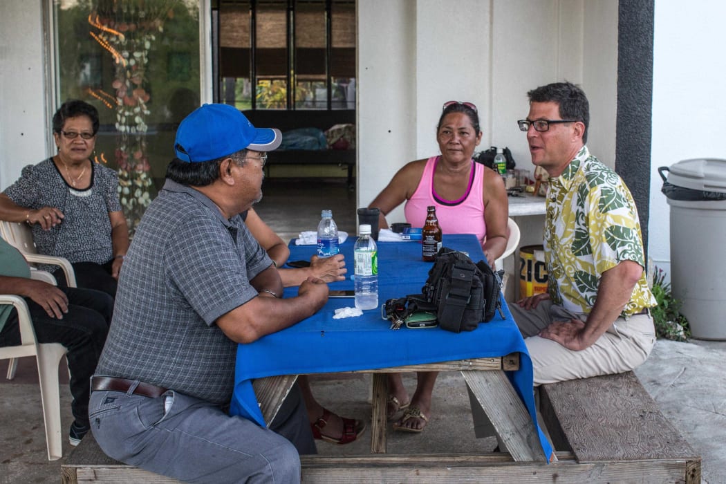 David Henkin (right) meets with Tinian residents concerned about proposed US military training on their island.