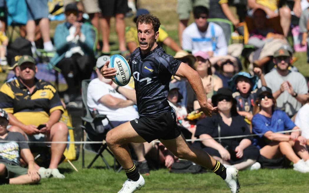 Kade Banks runs in a try during the Super Rugby Pacific pre-season match, Hurricanes v Blues.