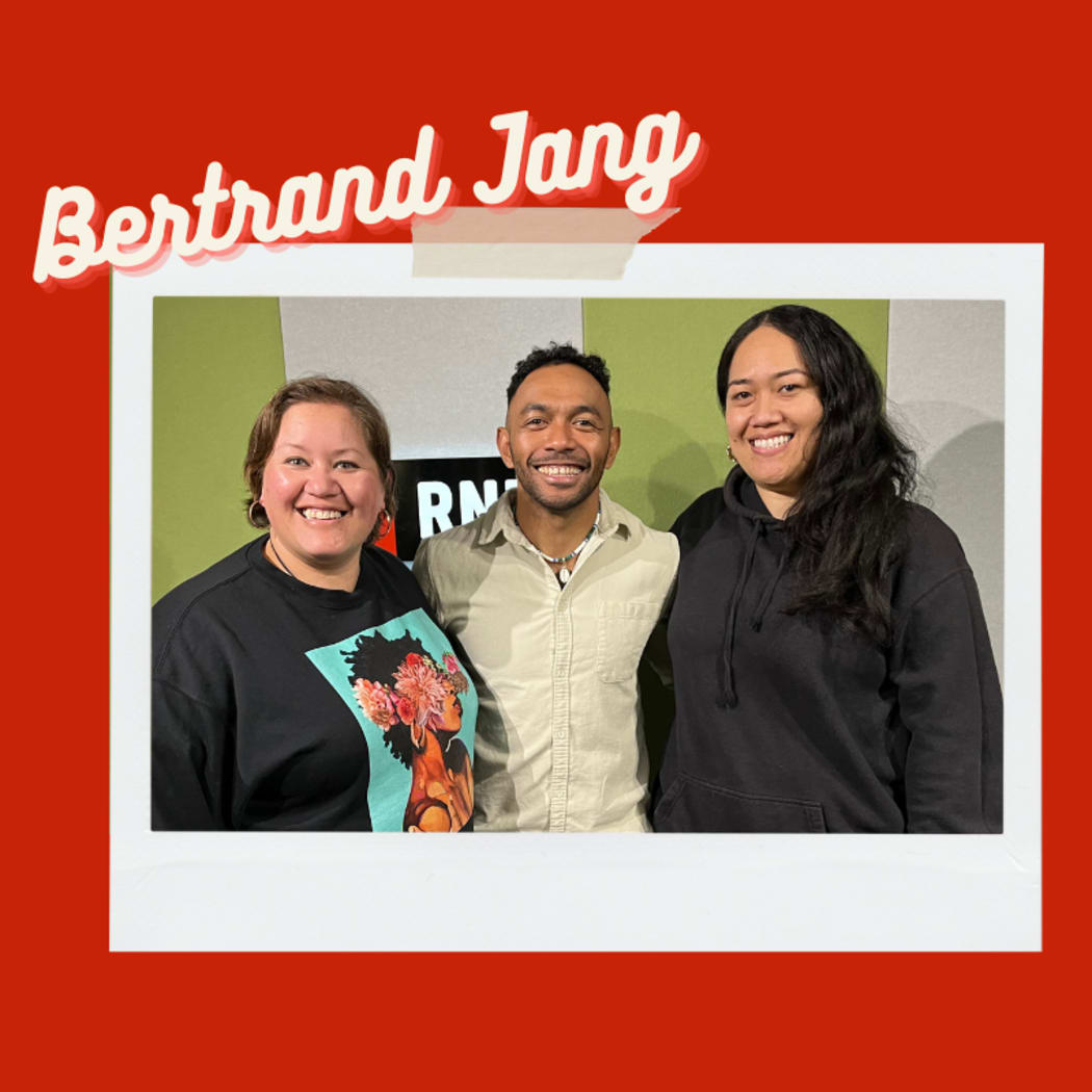 Two young women pose with renowned Auckland chef and baker of extraordinary cakes, Bertrand Jang.