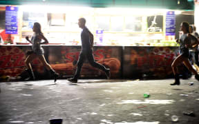 People run from the Route 91 Harvest country music festival after apparent gun fire was heard on October 1, 2017 in Las Vegas, Nevada.