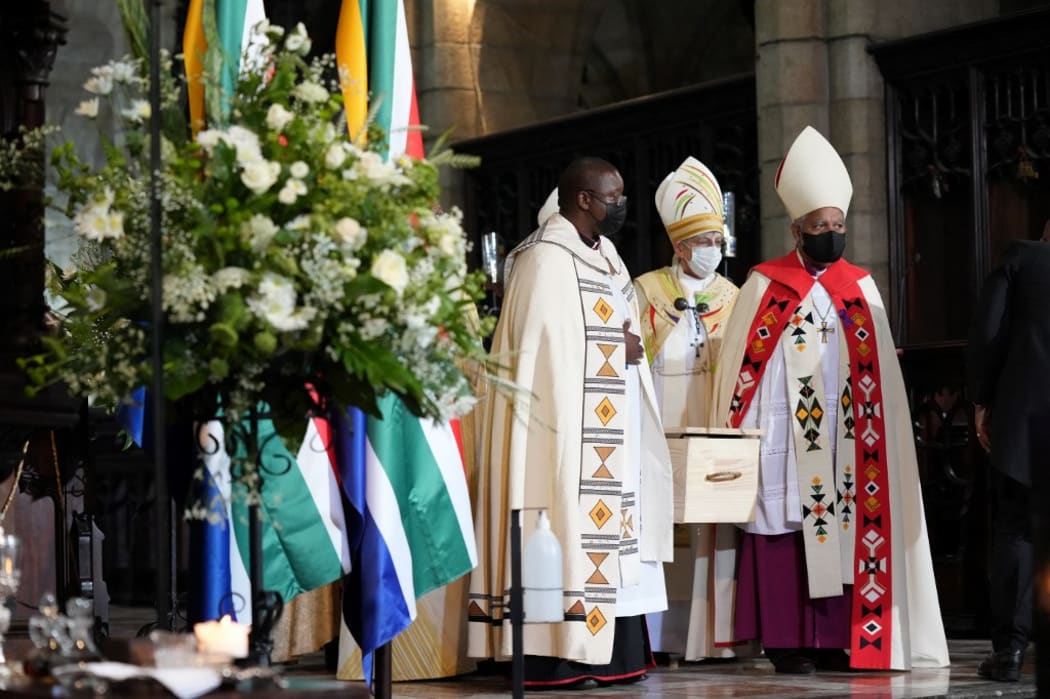 Pallbearers carry the coffin of South African anti-Apartheid icon Archbishop Desmond Tutu to the hearse after the requiem mass of Tutu at St. Georges Cathedral in Cape Town on January 1, 2022.