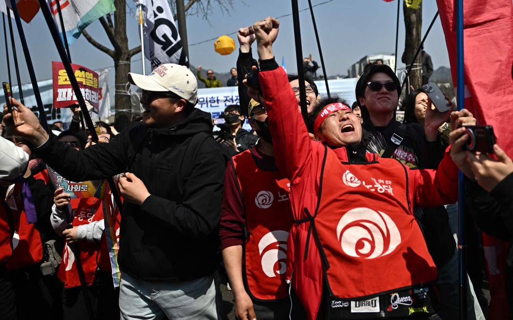 Anti-Yoon protesters react after the Constitutional Court's verdict on the impeachment of South Korea president Yoon Suk Yeol, in Seoul, on 4 April, 2025.