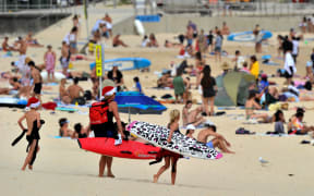 People enjoying Bondi Beach in Sydney on December 22, 2021.